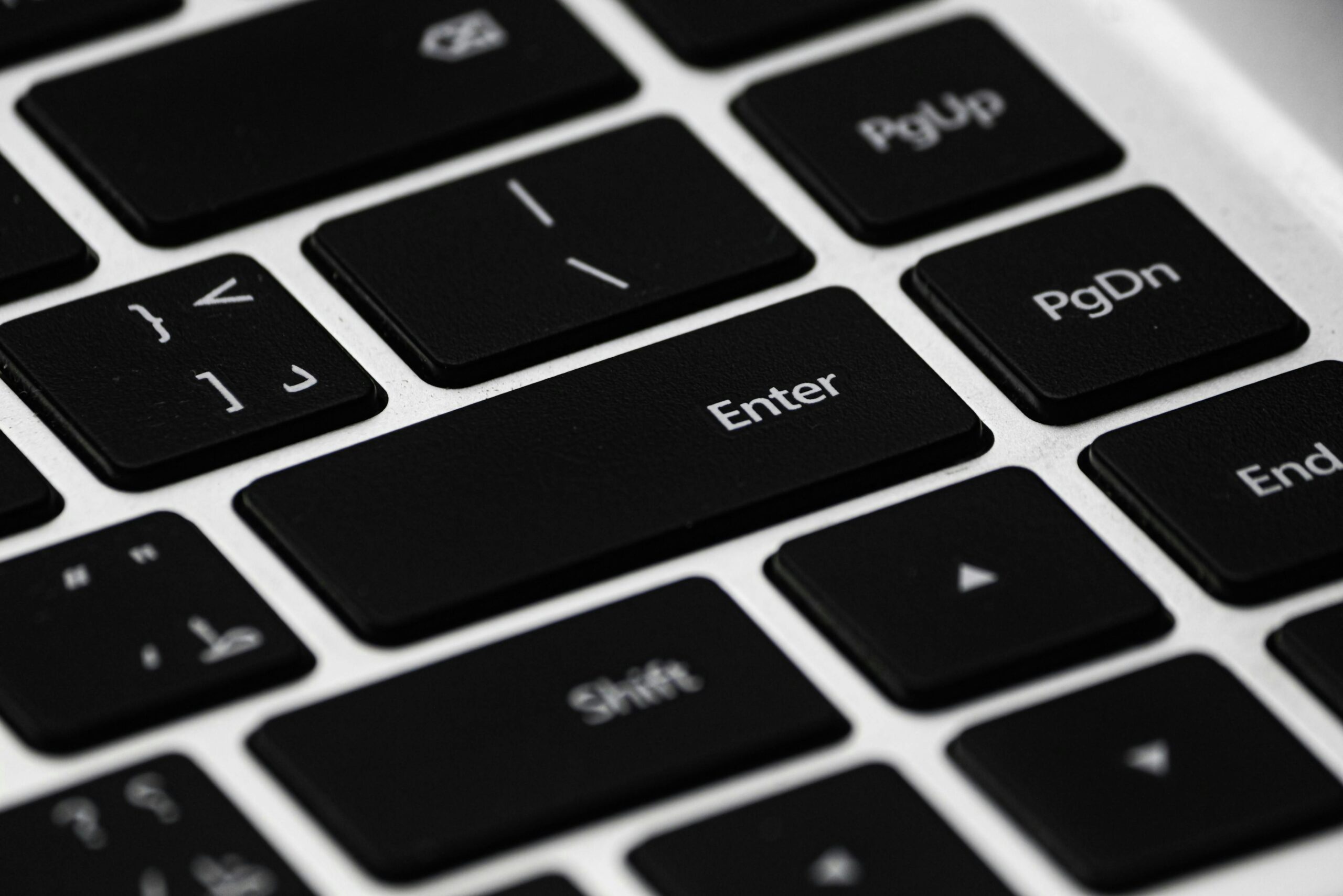 about-us High-resolution close-up of a black laptop keyboard emphasizing details and design.